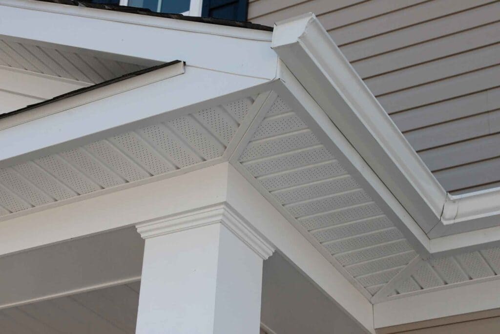 A view a soffit vent under a house roof