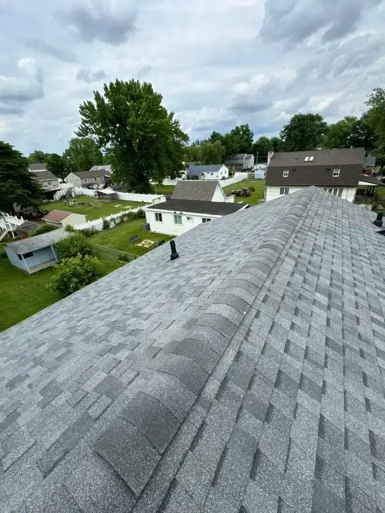 A view of a grey roof sheathing on top of the house