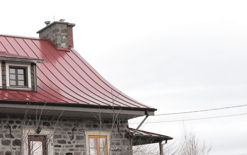 A view of a traditional house with a red eave roof