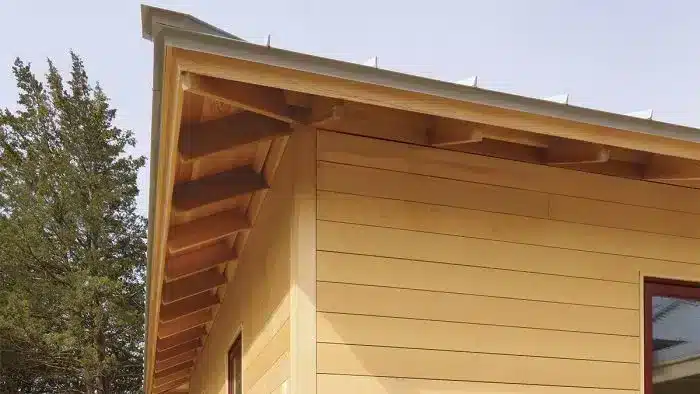 A view of a wooden exposed eave roof style