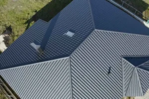 An overhead view of a grey metal roof of a house
