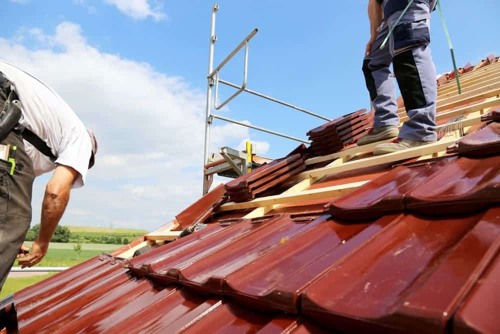 persons working on advanced roofing methods