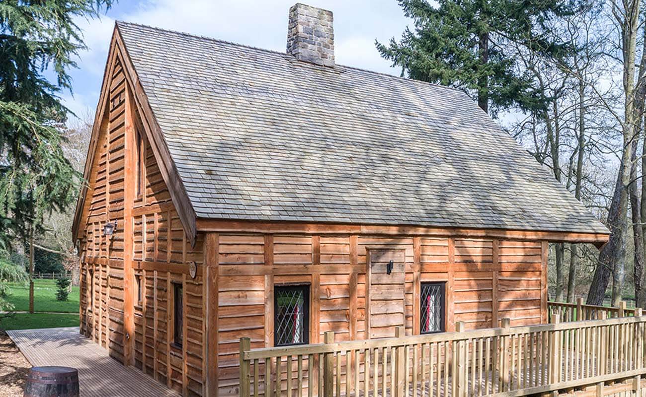 a wooden cabin with wooden roof