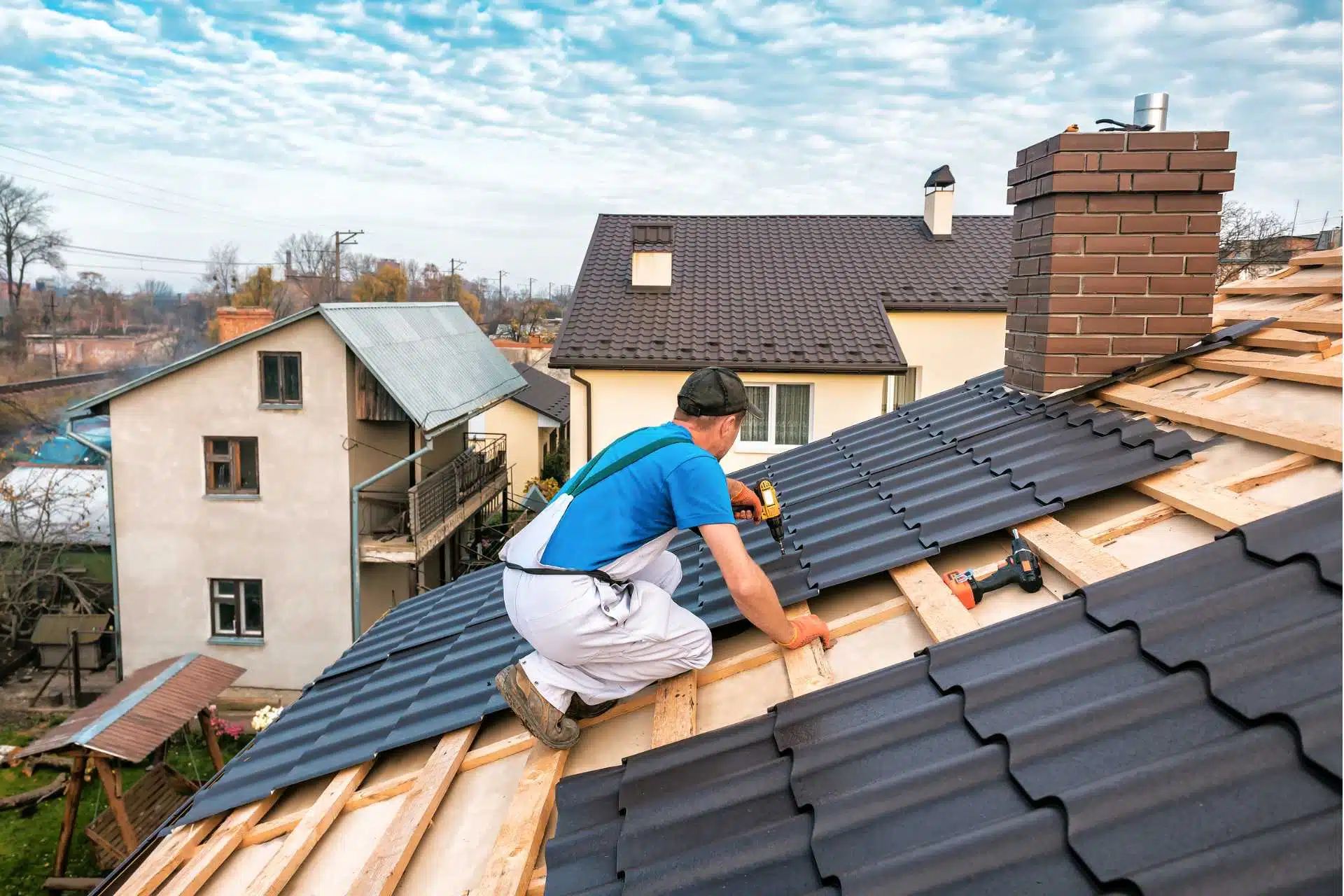 an expert roofer installing metal roof