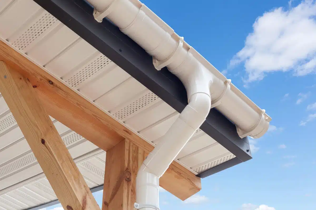 view of a white colored drain pipe on a roof ( )