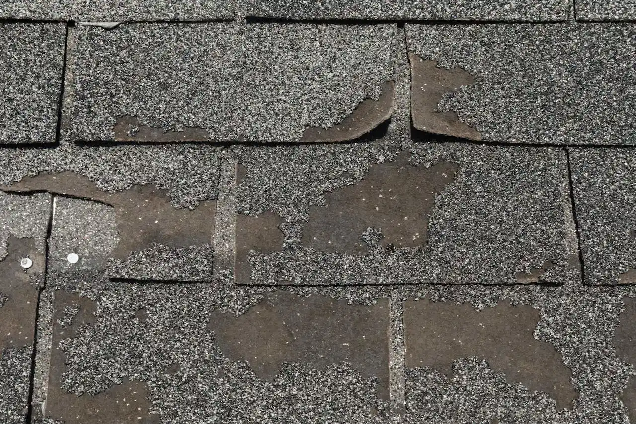Hail damage on asphalt shingles with missing granules