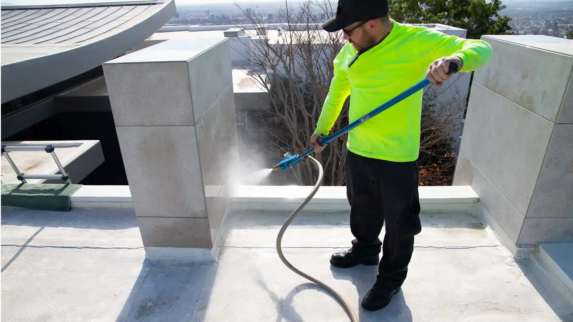 a roofing expert using hose to detect roof leakage