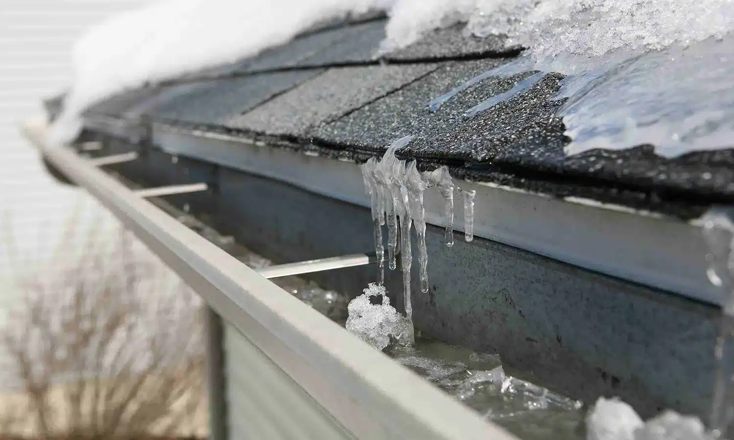 close up view of ice dam on a roof