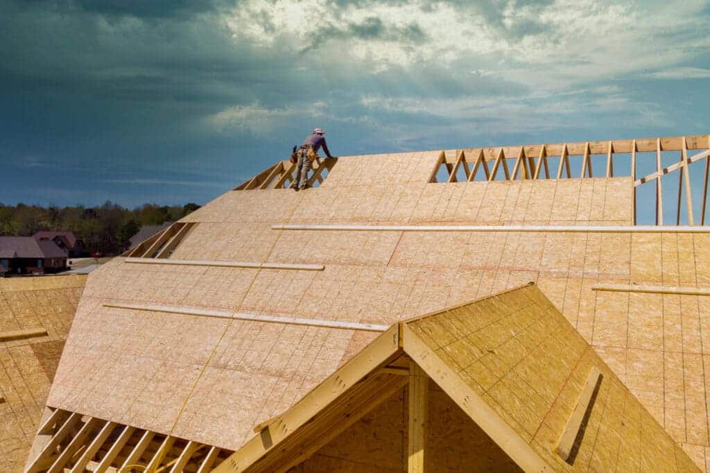 A view of a roof sheathing being performed