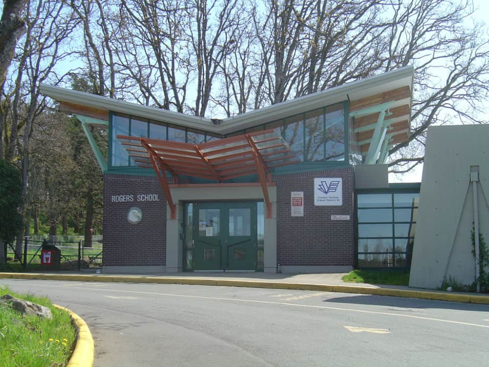 A view of a school with butterfly roofing