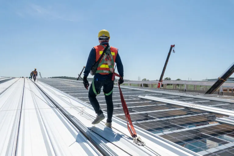 a contractor working pn metal roof installation x a contractor working pn metal roof installation x