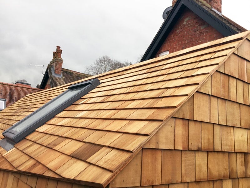 view of a roof with wood tiles